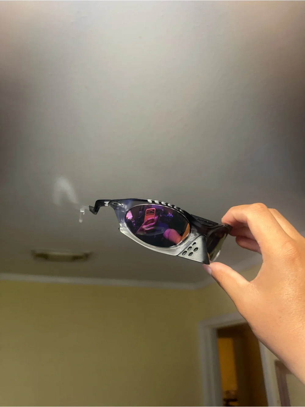 Sporty Black Sunglasses with Purple Mirrored Lenses Oakley